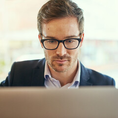 Businessman, laptop and glasses for planning, research and email in coffee shop for remote work....