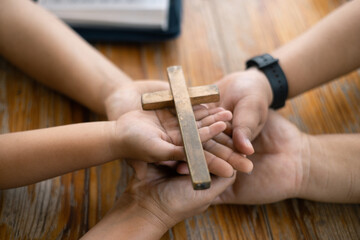 Group of Christian believers clasped hands in prayer, In the church, expressing their faith through...