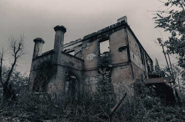 destroyed and burned houses in the city during the war in Ukraine