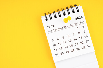 June 2024 Monthly desk calendar for 2024 year with thumbtack on yellow.