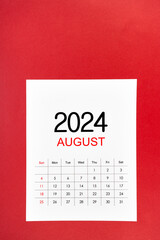 A August 2024 calendar page with push pin on red background.