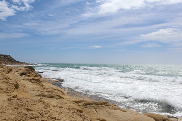 Fototapeta na wymiar beautiful view of seashore,waves on the beach, travel