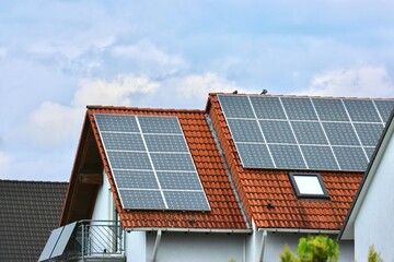 Fototapeta premium Modern solar system photovoltaik panels on the roof of an efficient, eco-friendly smarthome using renewable energy 