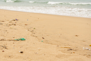 Sri Lanka, Bottles of plastic and garbage on the sand on the beach near the ocean, sea pollution catastrophe.