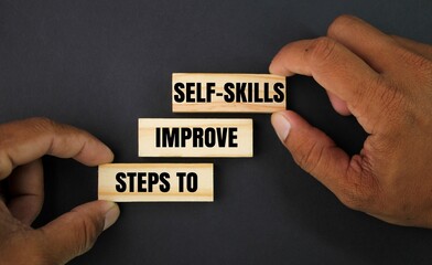 ladder-shaped stick with the words steps to improve self-skills. the concept of upgrading skills