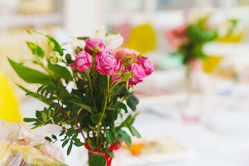 Delicate bouquet on a pink background of banquet table. copy space. Place for the inscription. Holiday Greeting Card