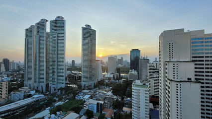 sunset hours in bangkok with skyscrapers
