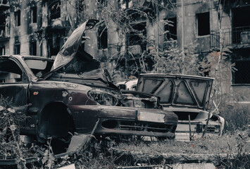 Fototapeta premium damaged and looted cars in a city in Ukraine during the war