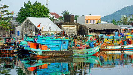 colorful fisherman ships in the harbor of phu quoc