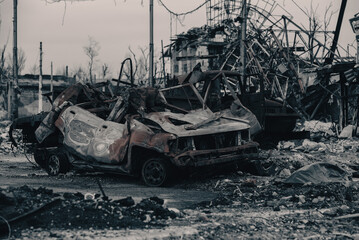 Fototapeta premium burnt cars and destroyed buildings of the workshop of the Azovstal plant in Mariupol
