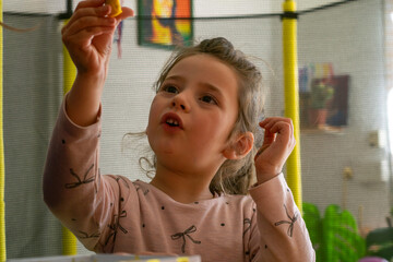 Enlightened innocence: girl enjoying at home
