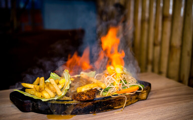 Closeup view of delicious sizzler on table.