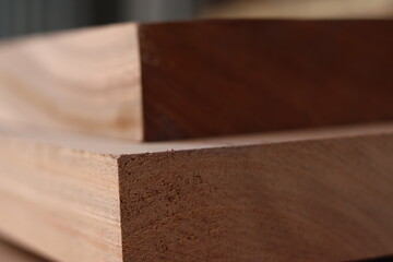 close up of planks of hardwood in storage