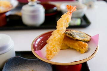Shrimp tempura served on a red plate