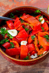 Grilled red peppers, sweet paprika salade with fresh garlic and parsley