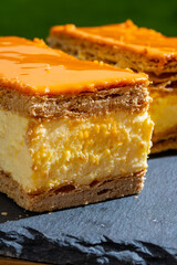 Celebration of the King birthday in Netherlands, tompoes or tompouce, iconic pastry in Netherlands made from puff dough, orange icing, cream