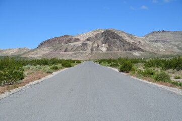 Country road leading to the Ghost town of Rhyolite in Nevada.