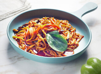 Chinese noodles with tomatoes, herbs, garlic and tomato sauce