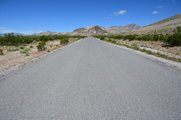 Country road leading to the Ghost town of Rhyolite in Nevada.