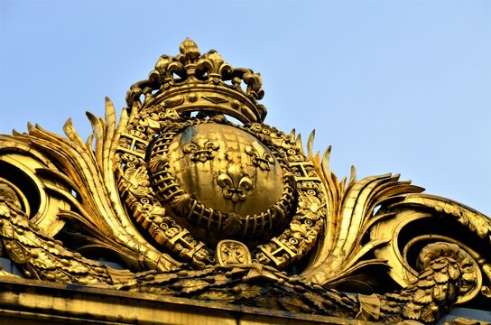 Paris, France 03.24.2017: Gilded Conciergerie clock hang on the Clock Tower of the Conciergerie in Paris