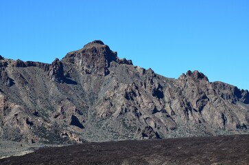 Scenic view of volcanic rock formations in desert during sunny day, Teide National Park, Tenerife