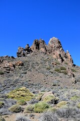 Scenic view of volcanic rock formations in desert during sunny day, Teide National Park, Tenerife