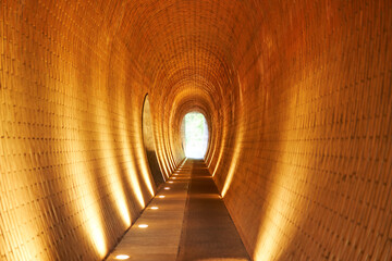 Pedestrian underpass, tunnel or corridor egg shaped and build from bricks in the garden of Prague...