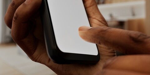 African-American Hand with smartphone in modern home, perfect for smart home app