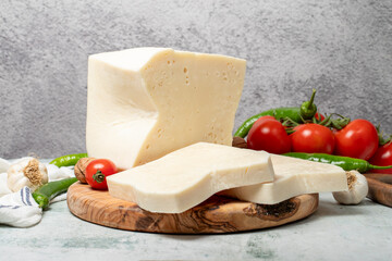 Ripened cheese. Cheese on wooden serving board. local name mihalic peyniri