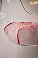 Foam covers car in garage tires, wheels, lights, hood, automotive design