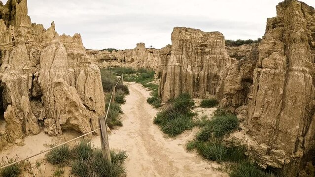 a dirt path across the natural sculptures at Aguarales de Valdemilaz, Valpalmas, comarca of Cinco Villas, province of Zaragoza, Aragon, Spain