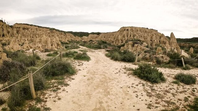 a dirt path across the natural sculptures at Aguarales de Valdemilaz, Valpalmas, comarca of Cinco Villas, province of Zaragoza, Aragon, Spain