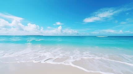 Beautiful sandy beach with gentle rolling sea waves accompanied by views of blue sky and white clouds