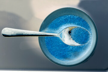 blue spoon with sugar