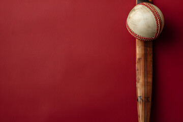 A cricket ball and bat, representing the sport's tradition, against a game day maroon background with copy space for match schedules or player profiles
