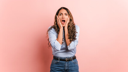 Surprised woman gesturing with mouth open looking at camera