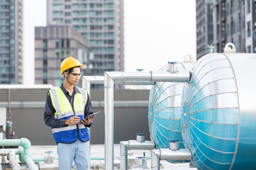 Male engineer worker checking, repair, maintenance operation sewer pipes area at construction site....