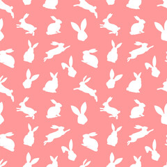 Fototapeta premium Easter seamless pattern of white rabbit silhouettes in different actions. Festive Easter bunnies design. Isolated on red background. For Easter decoration, wrapping paper, greeting, textile, print