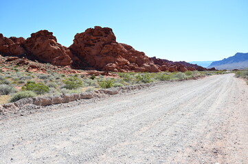 Unpaved road running through The Valley fo Fire state park in Nevada, USA.