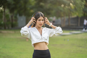 Portrait of sport slim fit strength asian woman training in sportswear sitting relax and practicing...