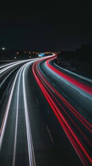 Nighttime long exposure of a road. A vibrant long exposure shot capturing the dynamic lights of cars traversing a road at night, reflecting the urban pulse