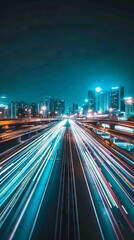 Obraz premium Nighttime long exposure of a road. A vibrant long exposure shot capturing the dynamic lights of cars traversing a road at night, reflecting the urban pulse