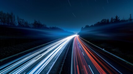 Obraz premium Nighttime long exposure of a road. A vibrant long exposure shot capturing the dynamic lights of cars traversing a road at night, reflecting the urban pulse