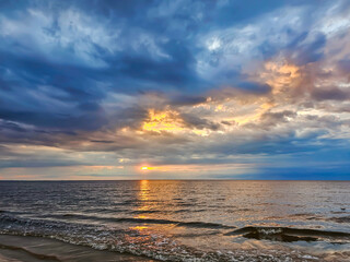 Magic sunset with cumulus clouds above the Baltic sea in Jurmala, Latvia. The beauty of the...