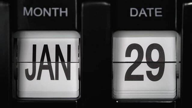 retro flip calendar with date change from the twenty-eighth of January to the twenty-ninth of January. daily calendar with change of days of the month. calendar concept, reminders, events. close up.
