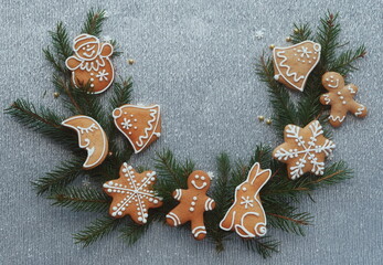 Christmas Gingerbread Cookies Pine Branches Decorative Icing Top View Gray Textured Background