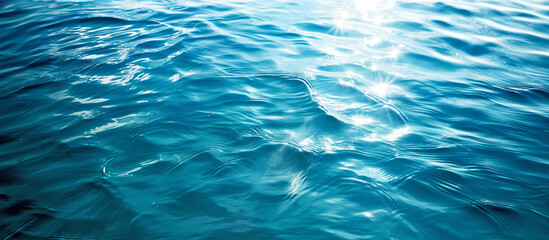 clear blue sea water surface with light reflections texture