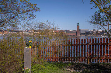 The bust of the Stockholm poet Olle Adolphson in his park, in background the down town, the Town...