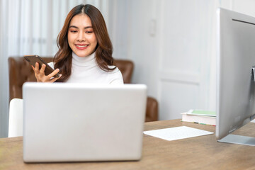 Young businesswoman work relaxing using technology laptop computer on table at office.Young...