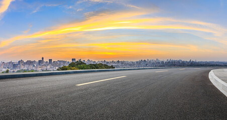 Asphalt highway road and city skyline at sunrise in Hangzhou. Panoramic view.